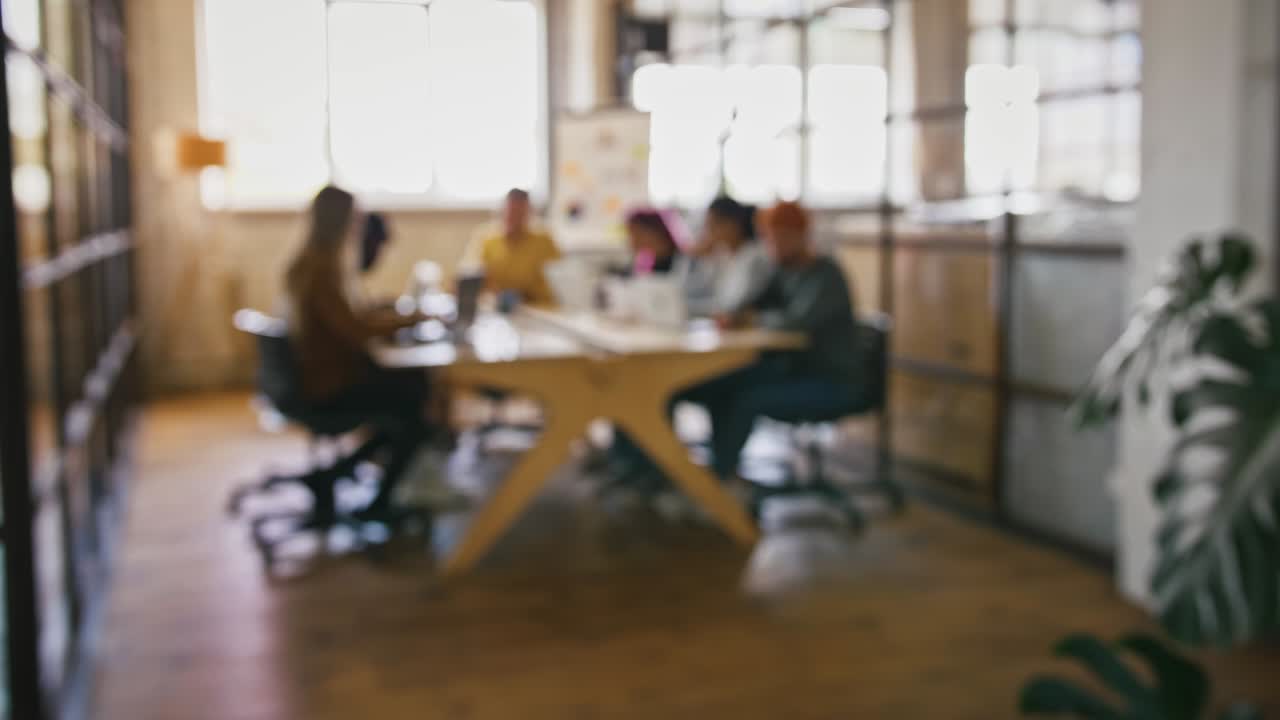 Startup business background. Blurred shot of creative team working at office