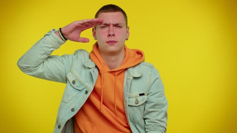 responsible stylish man giving salute listening to order as if soldier following discipline obeying