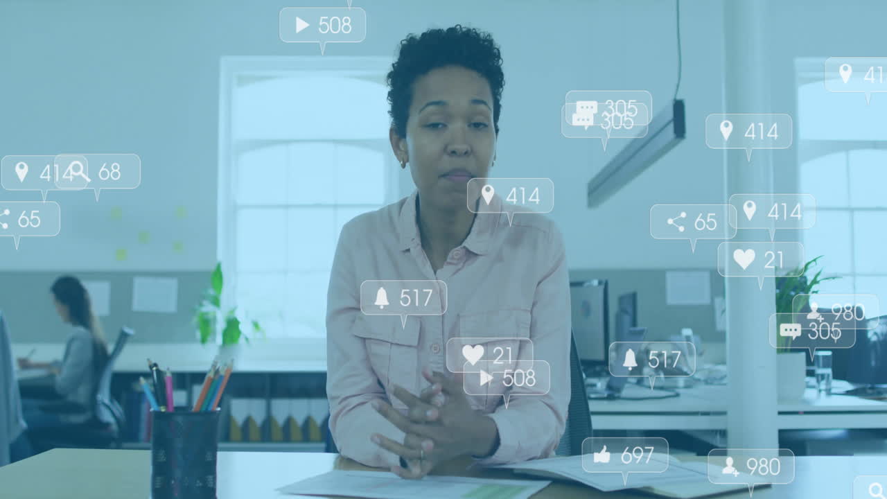 Female presenter handling paperwork at office with floating social media stats driving marketing
