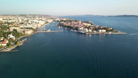 aerial view of a coastal city with a historic peninsula and harbor