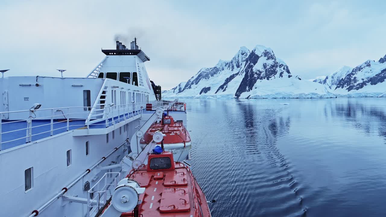Cruise Ship Sailing Through Antarctic Icebergs