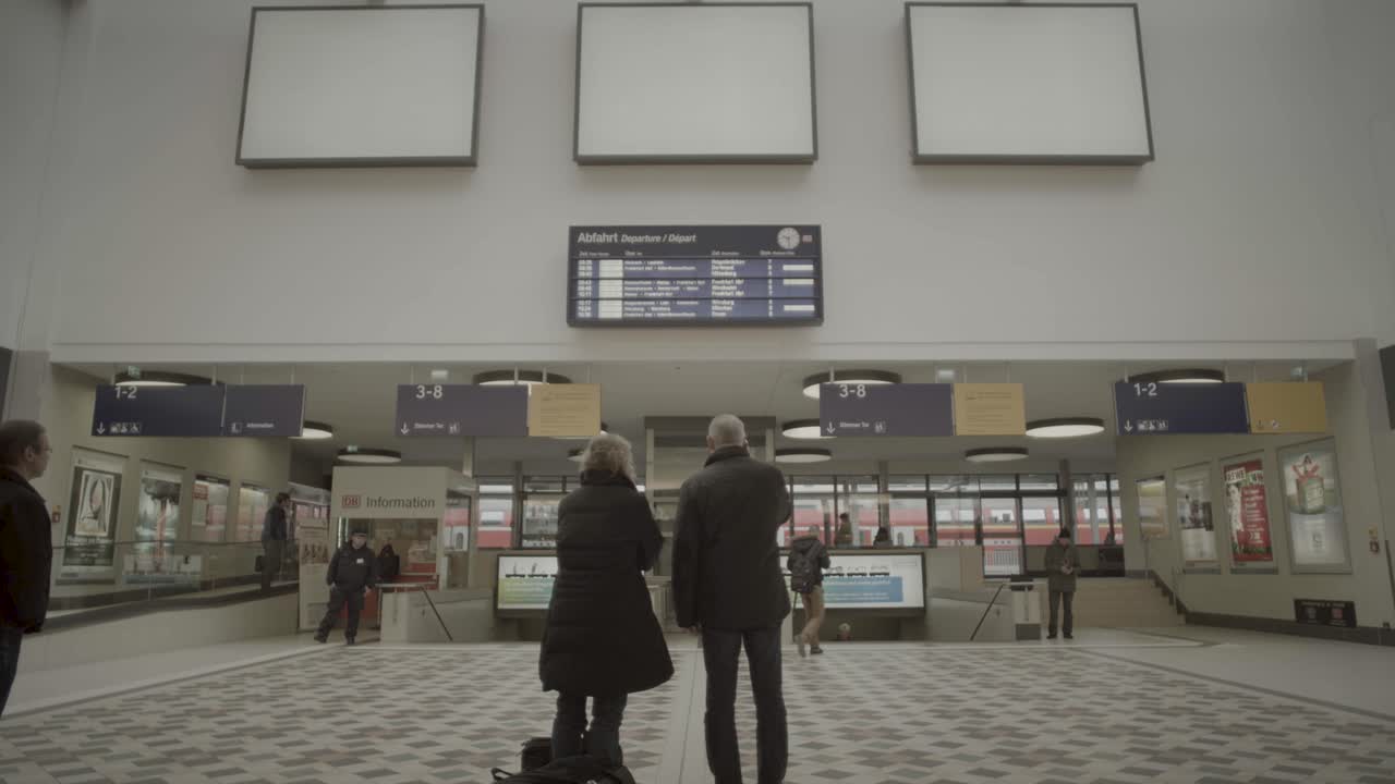 Busy Berlin Central Station platform with commuters arriving and departing