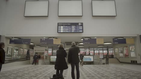 busy berlin central station platform with commuters arriving and departing