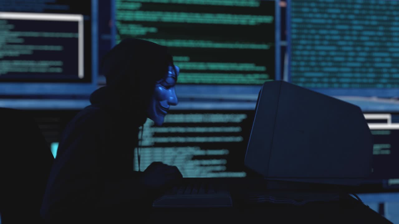 Hooded hacker succeeding to breach security server