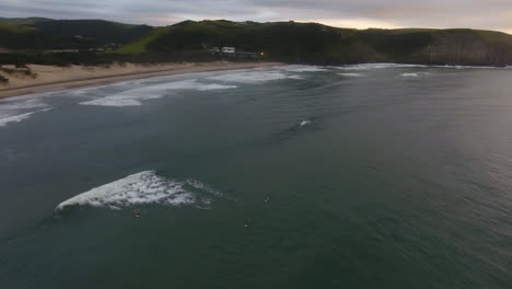 cinematic aerial flying over coast of east london south africa