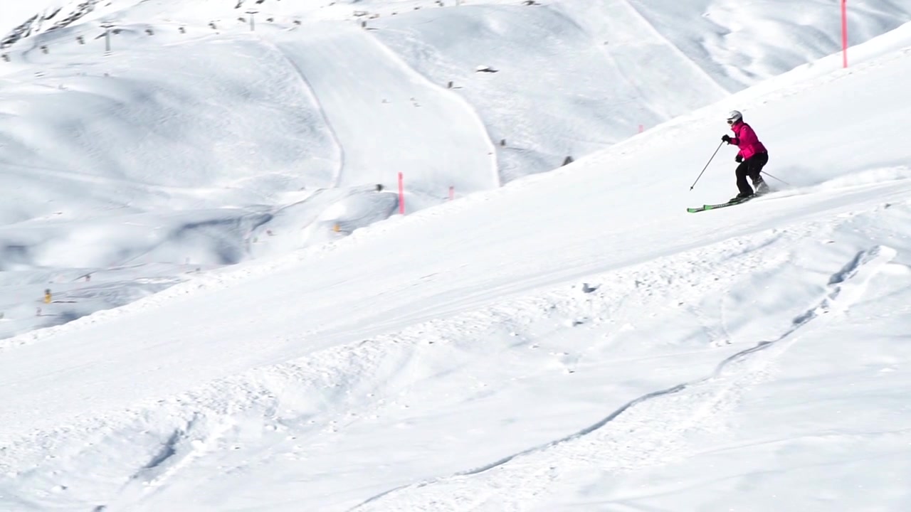 woman skiing on a beautiful winter day in arosa, switzerland