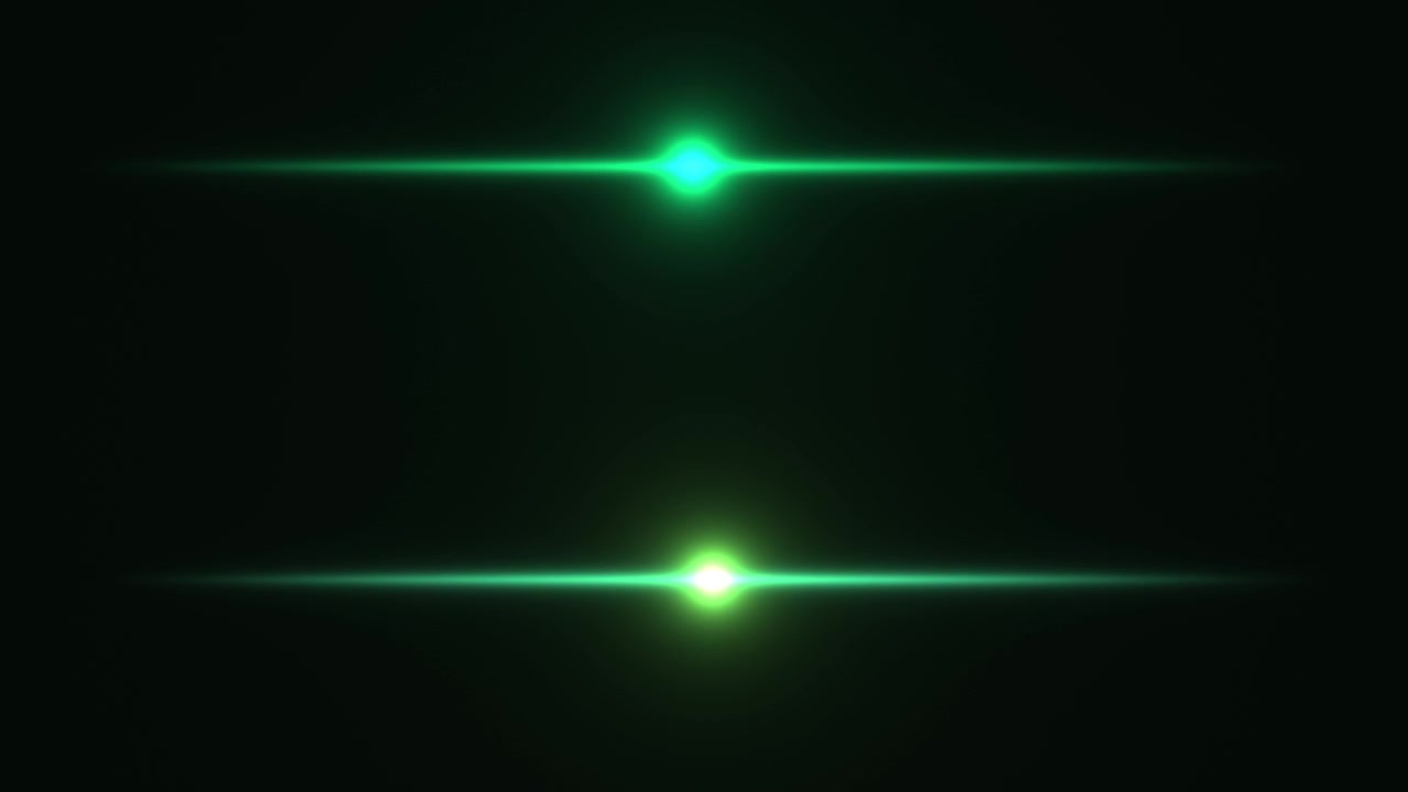Strisce di luce verde appaiono e si muovono rapidamente su uno sfondo scuro, creando un senso di movimento ed energia. Le luci variano in luminosità e posizione, aggiungendo elementi dinamici