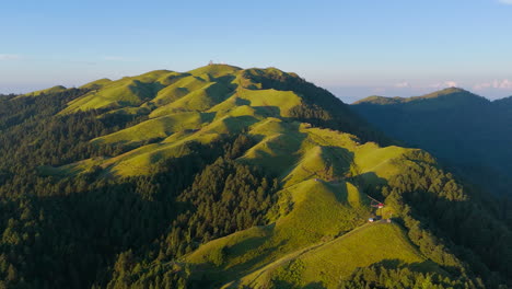 nepal's aerial view captures green hills of shailung forest-covered trekking trails and adventurous mountains under blue morning sky horizon reveals peaceful landscape perfect for tourism exploration