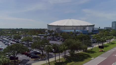 4k aerial drone video of tropicana field and full parking lot in downtown st