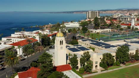 aerial approach of a tower and tennis courts in la jolla, california