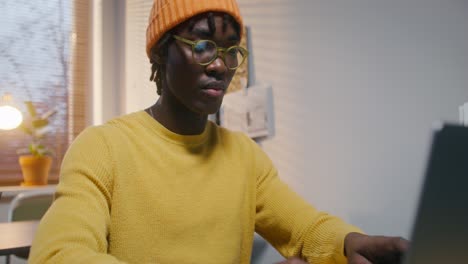 young man working on laptop