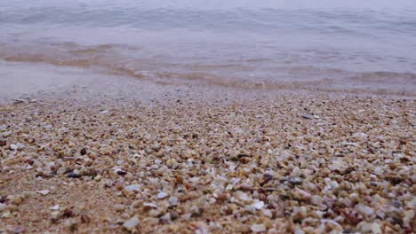 experience the soothing sound of waves meeting the shore at a serene beach inviting relaxation and peace.