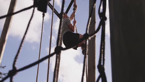 young man training at an outdoor gym bootcamp