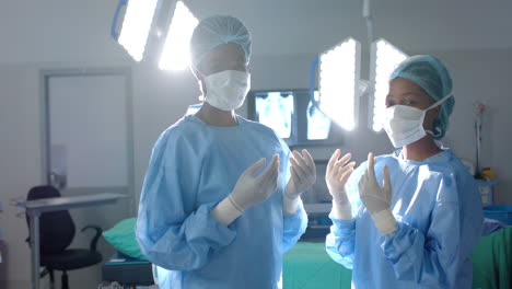 surgeons prepare for surgery in a bright operating room