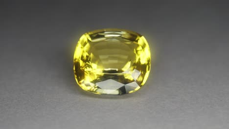 Polished-yellow-gemstone-rotates-and-sparkles