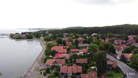 Architecture-of-resort-town-Nida-in-aerial-descending-view