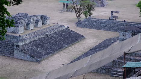 pan over hieroglyphic stairway and ball court in acropolis, copan ruins