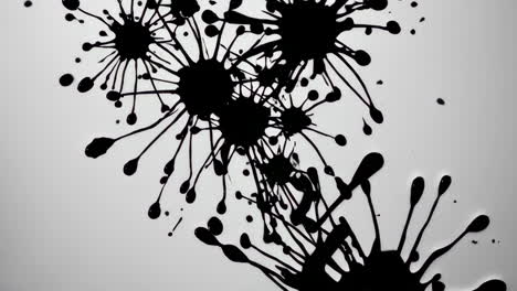 abstract black ink splatters on white background