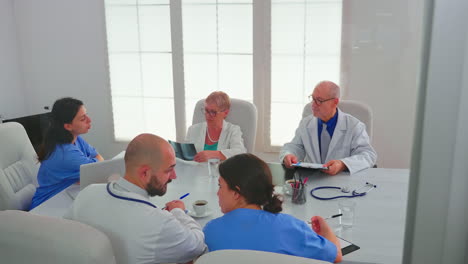 healthcare workers having meeting in hospital conference room