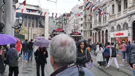 istanbul street scene with tram in rainy weather