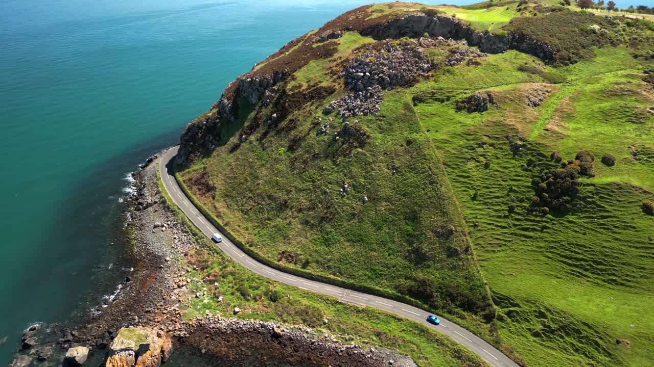 Ascending aerial video of the Antrim Coastal Route on a bright and sunny day. Filmed in Ballygally in 4K, 60FPS and with Rec800 color.
