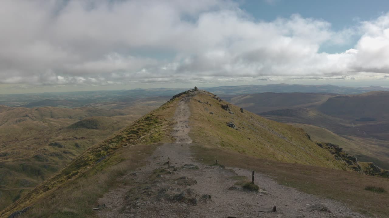 static shot of a ridge line on Ben Vorlich leading to a stone stack