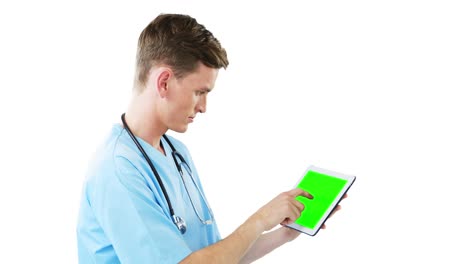 Male-surgeon-using-digital-tablet