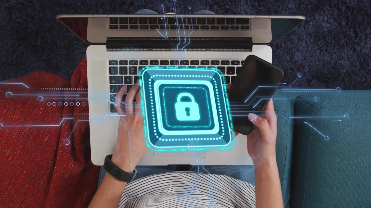 Woman switching between laptop typing and phone handling, tapping, invoking holo lock for security