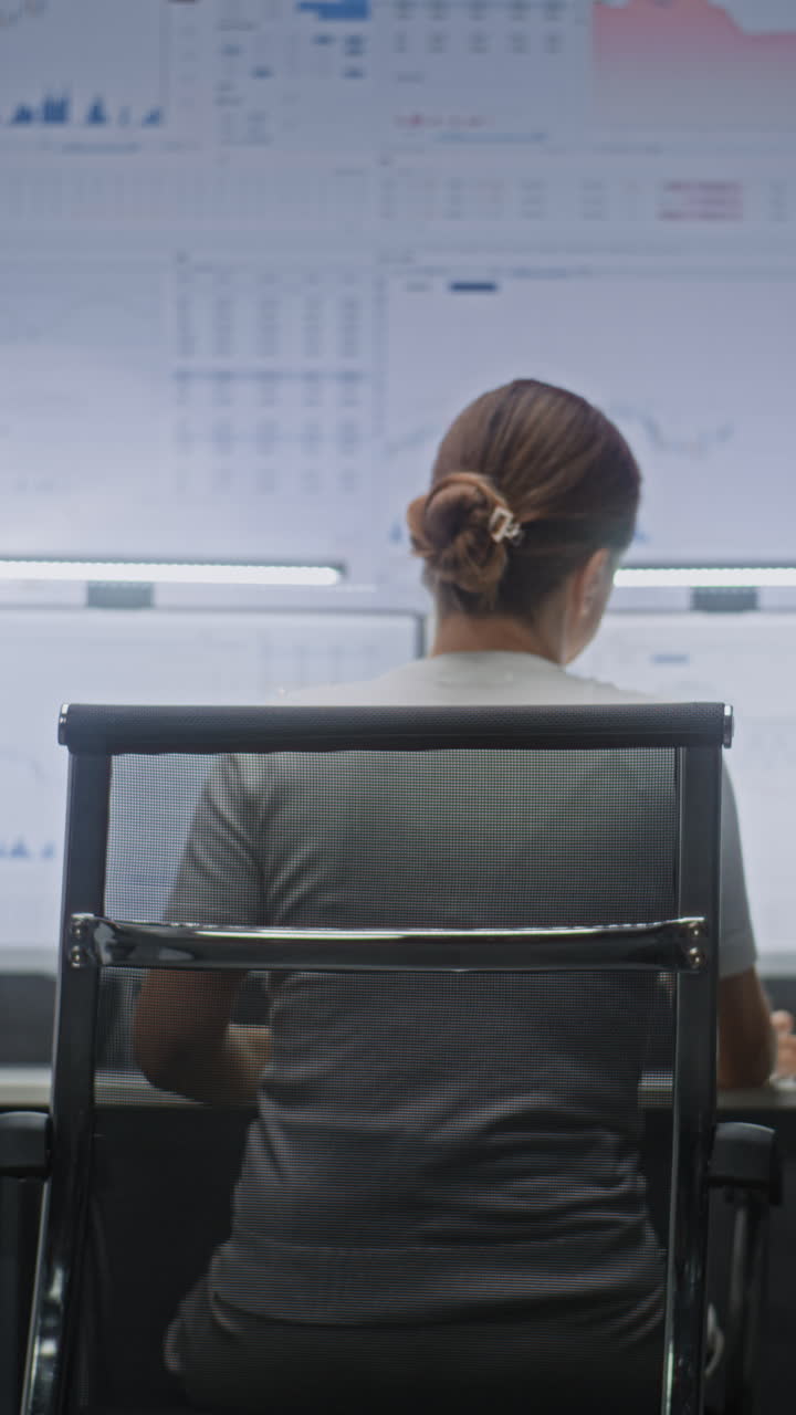 Female Stock Exchange Broker Monitoring Real-Time Stocks, Exchange Market Charts on Computer with Multi-Monitor Desktop Setup. Professional Investment Agent Working in Financial Agency Office at Night