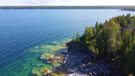 Aerial-Drone-Fly-Above-Georgian-Bay-Sea-Coastline-Landscape,-Ontario,-Canada-Sky