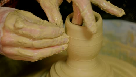 professional male potter making ceramics in workshop