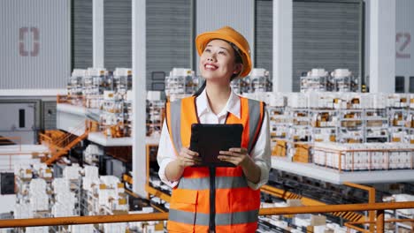 warehouse worker inspecting inventory with tablet