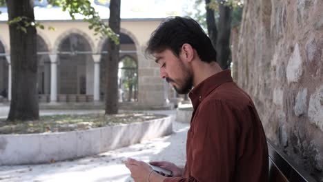 man looking in mosque garden