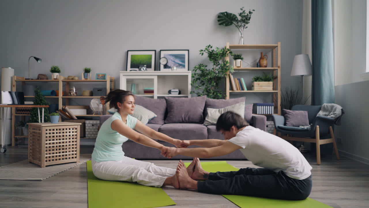 Couple Doing Partner Yoga Stretch