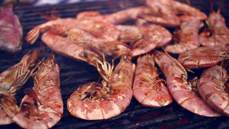 seafood grill. grilled shrimps on barbecue grill. cooking seafood on barbeque