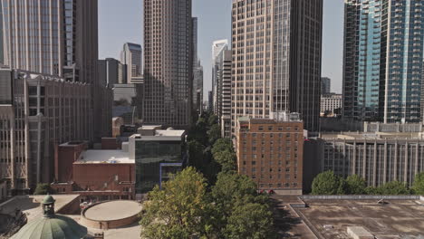 charlotte north carolina aerial v179 low flyover tryon street capturing vibrant downtown cityscape, lined with leafy trees and towering skyscrapers - shot with mavic 3 pro cine - oct 2st 2023