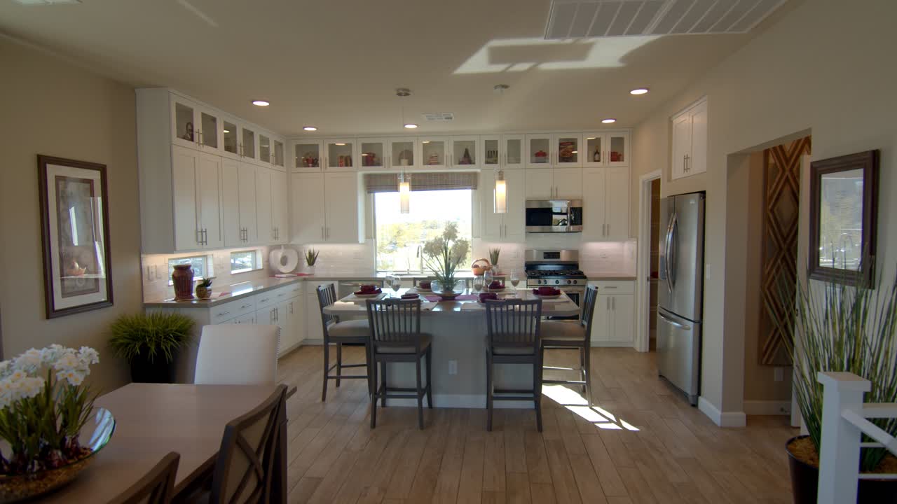 The Fully Furnished Dining Room In Las Vegas Nevada Surrounded With Wall Cabinet And Glass To Make The Area More Spacious - Wide Shot