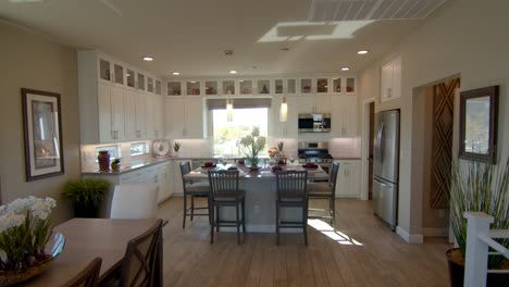 the fully furnished dining room in las vegas nevada surrounded with wall cabinet and glass to make the area more spacious - wide shot