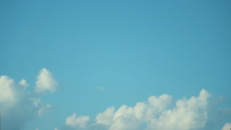 Time-lapse,-fast-motion-shot-of-a-surfing-white-clouds-in-the-blue-skies,-4K-Video