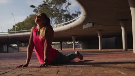 Caucasian-woman-working-out-under-a-bridge