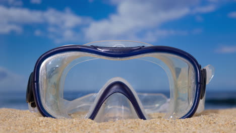 a snorkel mask on the beach