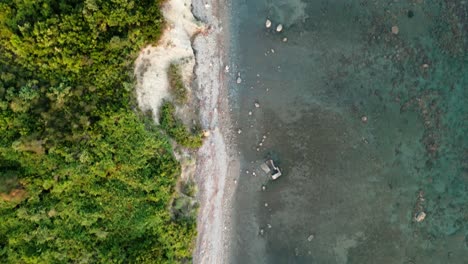 the adriatic sea, coastline separating the blue water from the steep cliff