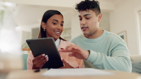 Home,-conversation-and-couple-with-a-tablet