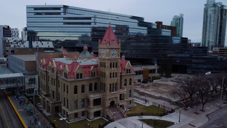 aerial shot moving up of calgary city hall