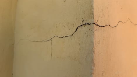 one large crack in wall showing the crack in detail with a corner, good video clip for showing wall damage or home repairs needed