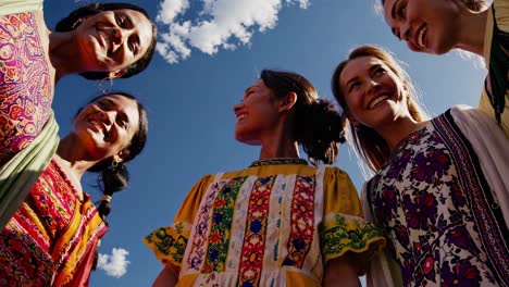 women in traditional clothing celebrate together