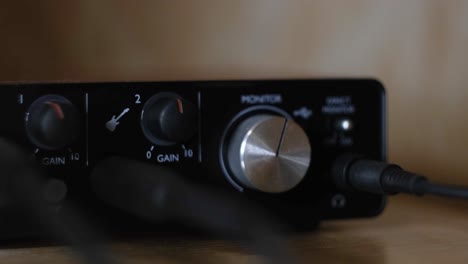 close-up of audio interface with gain controls