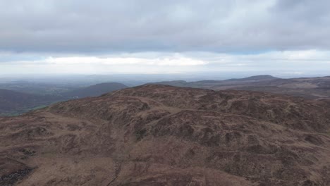 a vast, scenic view of the rugged hills of county kerry, ireland, captured from above