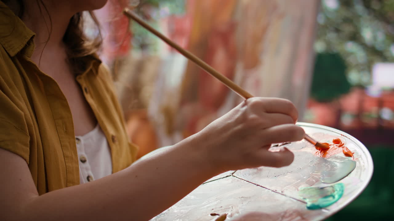 Artist painting with a palette