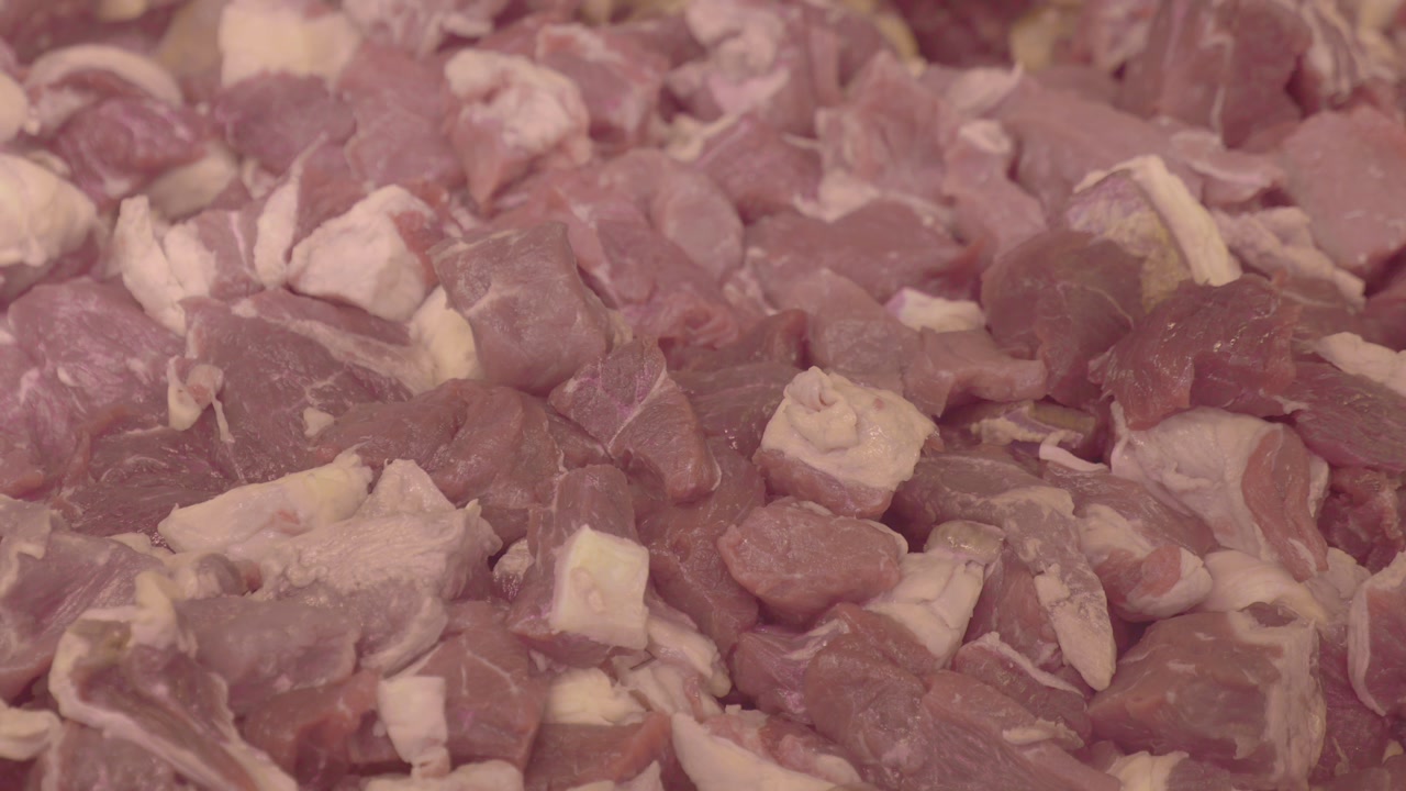 Close Up of Fresh Diced Raw Meat Pieces